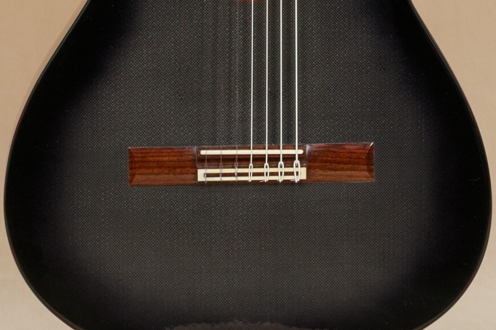 Ryer carbon fibre guitar rosewood bridge detail